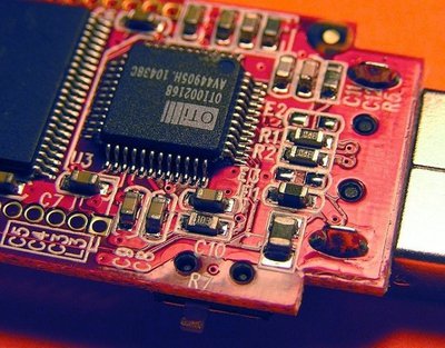 orange circuit board with components